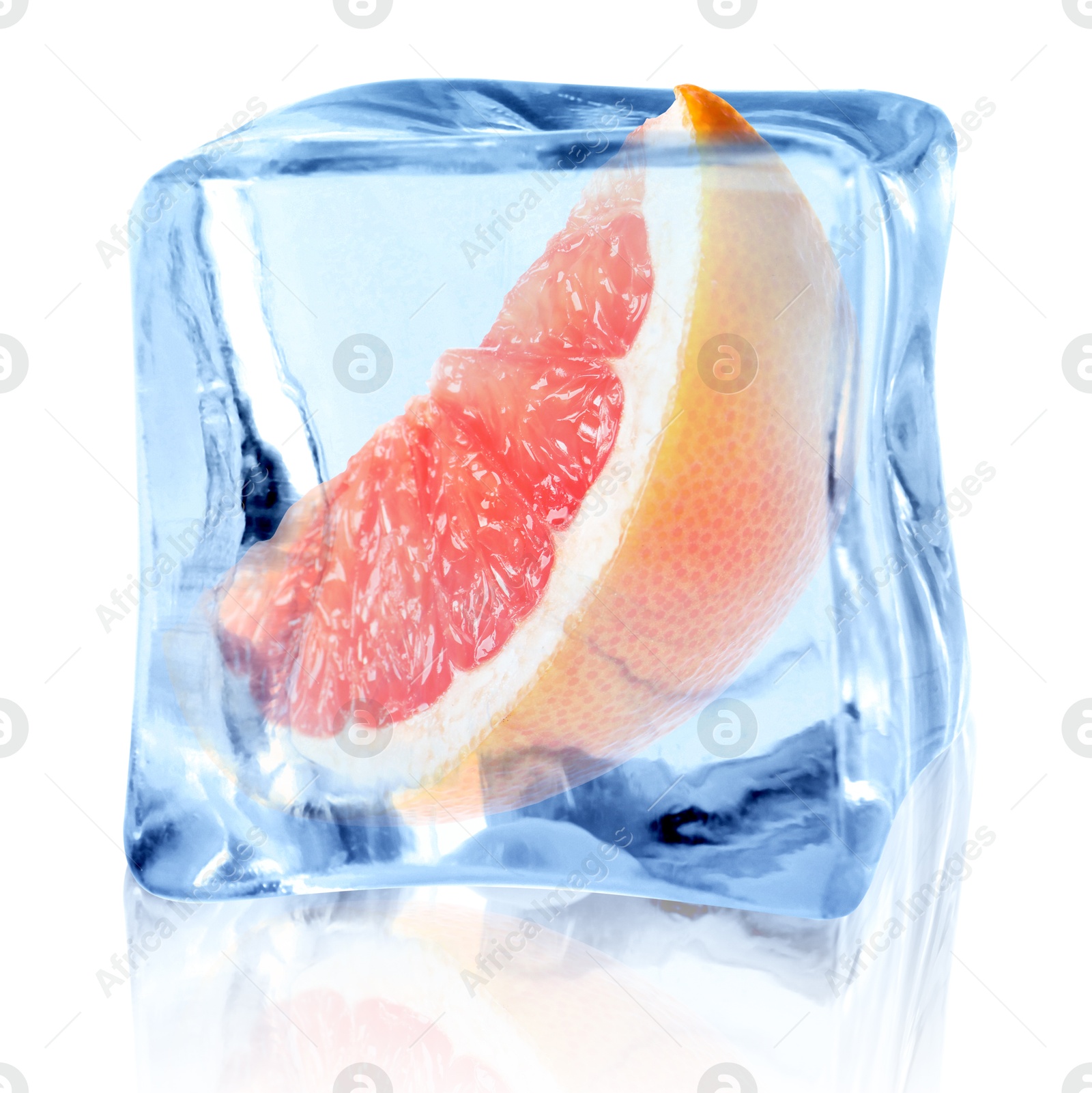 Image of Piece of fresh grapefruit inside ice cube on white background