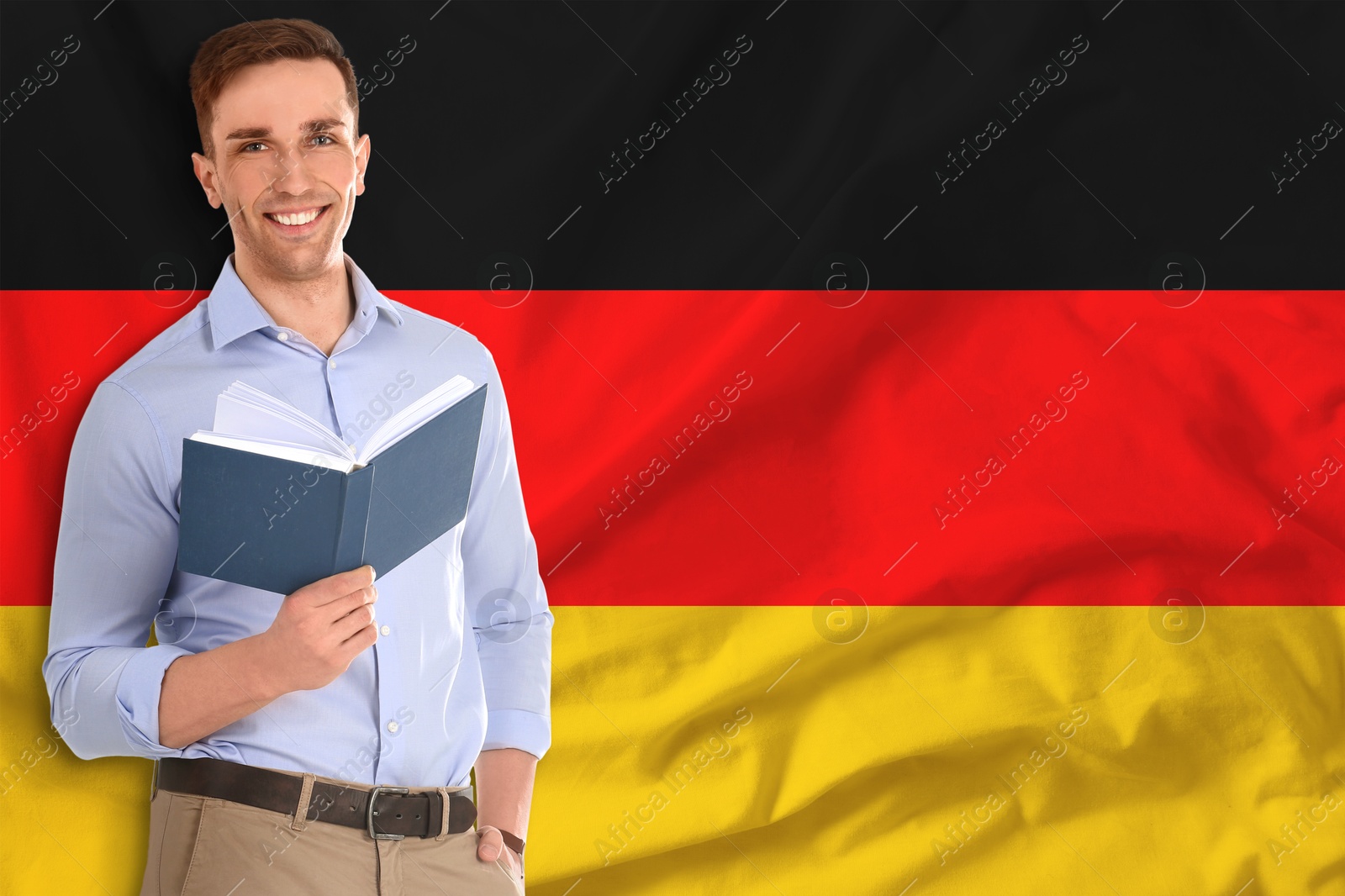 Teacher with book against flag of Germany. Language school Image of Teacher with book against flag of Germany. Language school