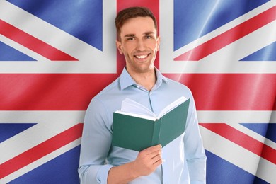 Image of Teacher with book against flag of United Kingdom. Language school