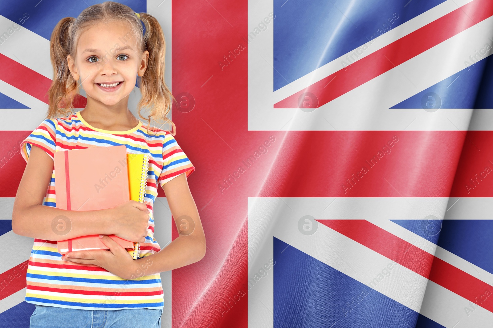Little girl with notebooks against flag of United Kingdom. Language school Image of Little girl with notebooks against flag of United Kingdom. Language school