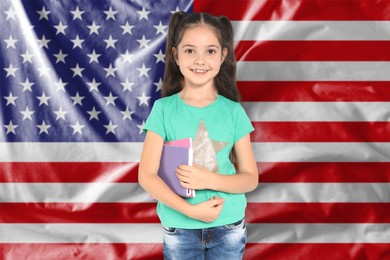 Image of Little girl with notebooks against flag of USA. Language school