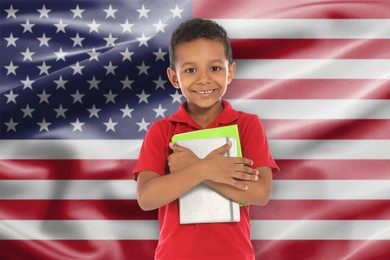 Image of Little boy with notebooks against flag of USA. Language school