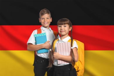 Image of Children with backpacks and notebooks against flag of Germany. Language school