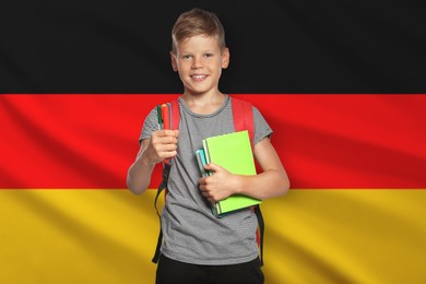 Image of Little boy with backpack and stationery against flag of Germany. Language school