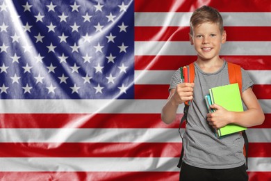 Image of Little boy with backpack and stationery against flag of USA. Language school