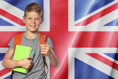 Image of Little boy with backpack and stationery against flag of United Kingdom. Language school