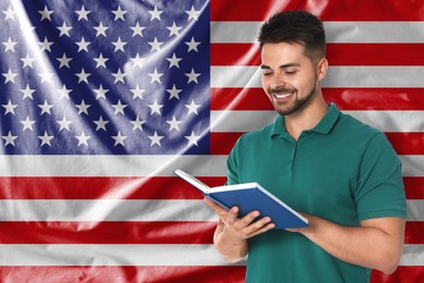 Image of Teacher or student with book against flag of USA. Language school