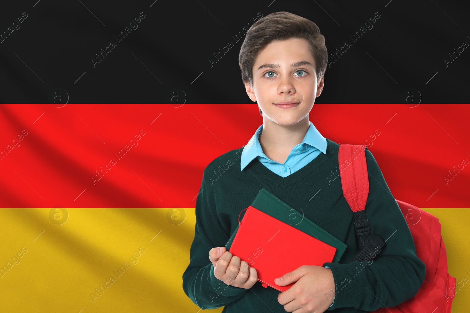 Student with backpack and notebooks against flag of Germany. Language school Image of Student with backpack and notebooks against flag of Germany. Language school