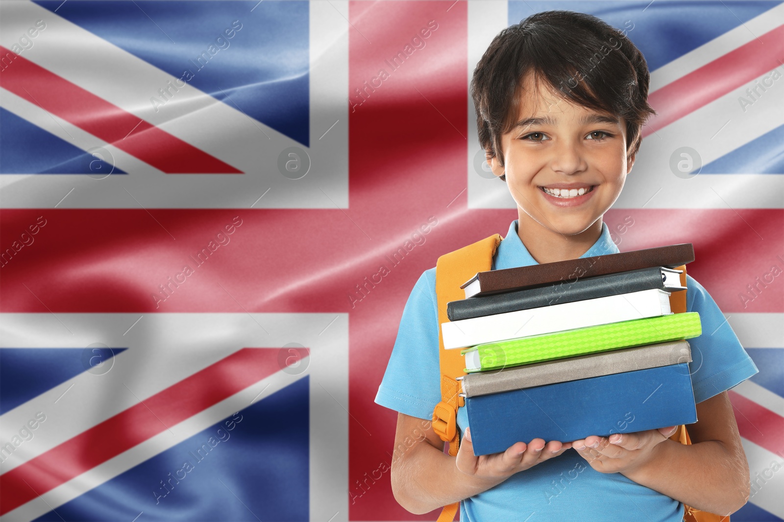 Little boy with books and backpack against flag of United Kingdom. Language school Image of Little boy with books and backpack against flag of United Kingdom. Language school