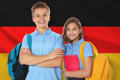 Image of Students with backpacks against flag of Germany. Language school