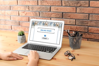 Image of Online study. Woman using laptop for e-learning at desk, closeup