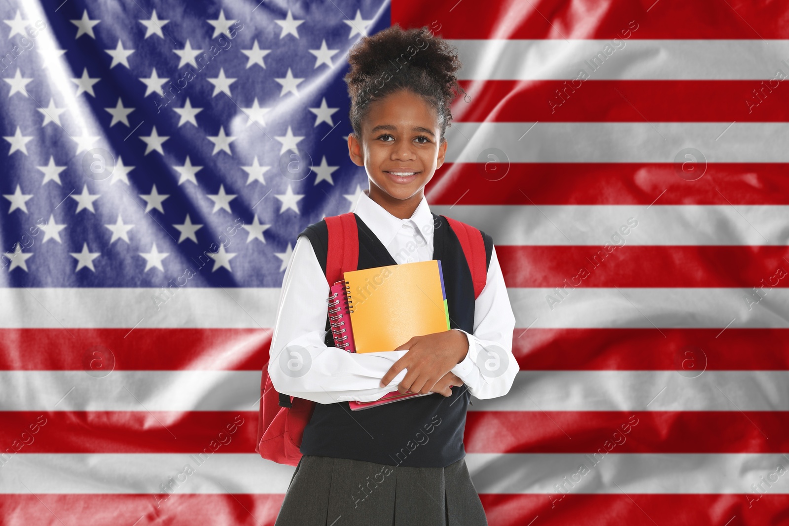 Little girl with backpack and notebooks against flag of USA. Language school Image of Little girl with backpack and notebooks against flag of USA. Language school