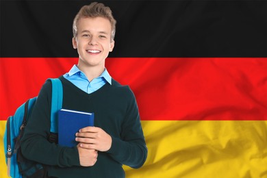 Image of Student with backpack and book against flag of Germany. Language school