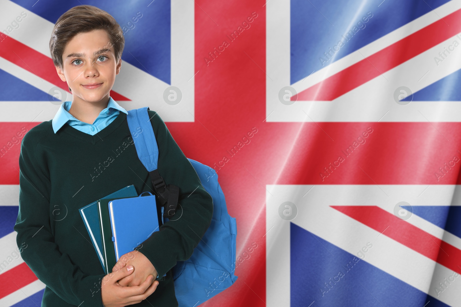 Student with backpack and books against flag of United KIngdom. Language school Image of Student with backpack and books against flag of United KIngdom. Language school