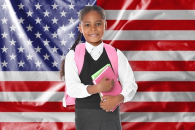 Image of Little girl with backpack and notebooks against flag of USA. Language school