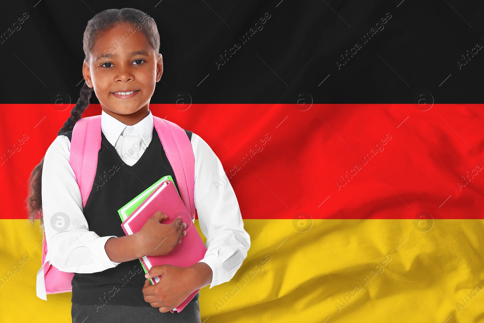 Little girl with backpack and notebooks against flag of Germany. Language school Image of Little girl with backpack and notebooks against flag of Germany. Language school
