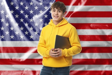 Image of Student with laptop against flag of USA. Language school