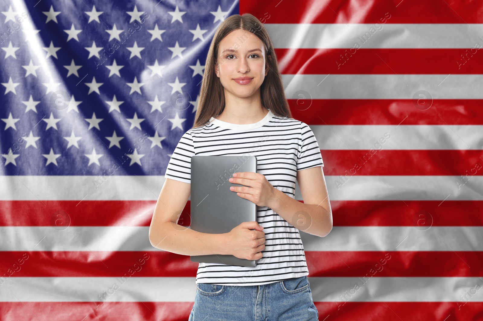 Student with laptop against flag of USA. Language school Image of Student with laptop against flag of USA. Language school