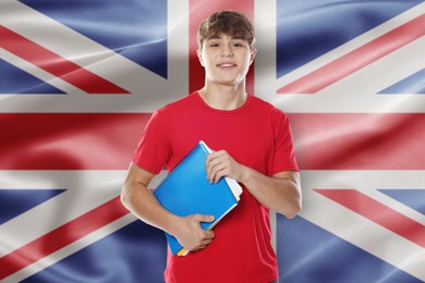Image of Student with notebooks against flag of United Kingdom. Language school