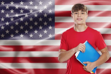Image of Student with notebooks against flag of USA. Language school