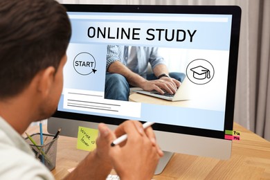 Image of Online study. Man using computer for e-learning at desk, closeup