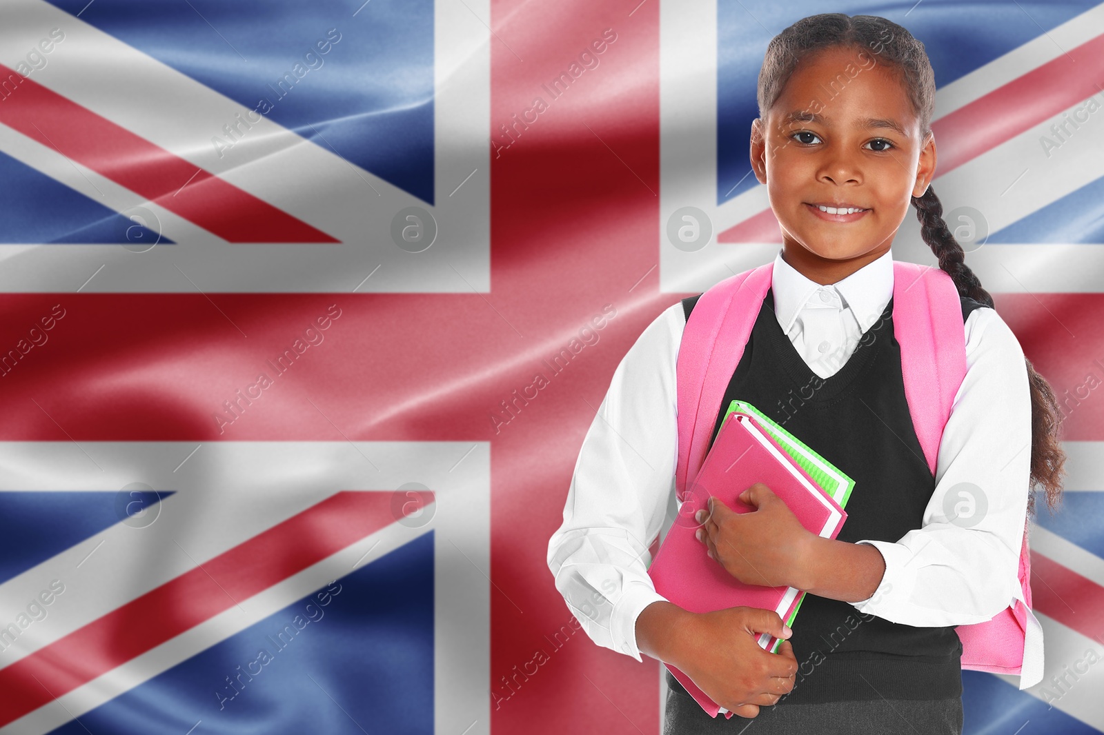 Little girl with backpack and notebooks against flag of United KIngdom. Language school Image of Little girl with backpack and notebooks against flag of United KIngdom. Language school