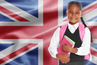 Image of Little girl with backpack and notebooks against flag of United KIngdom. Language school