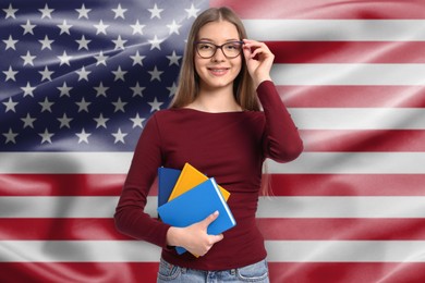 Image of Student with notebooks against flag of USA. Language school