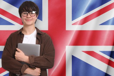 Image of Student with laptop against flag of United Kingdom. Language school