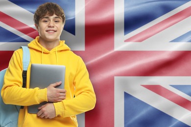 Image of Student with laptop and backpack against flag of United Kingdom. Language school
