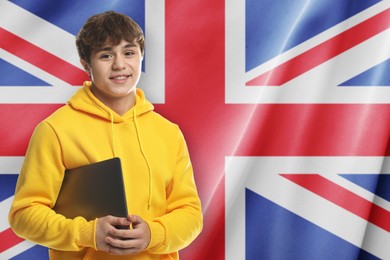 Image of Student with laptop against flag of United Kingdom. Language school