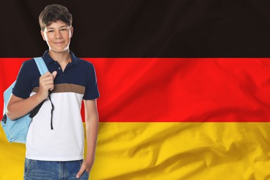 Image of Student with backpack against flag of Germany. Language school