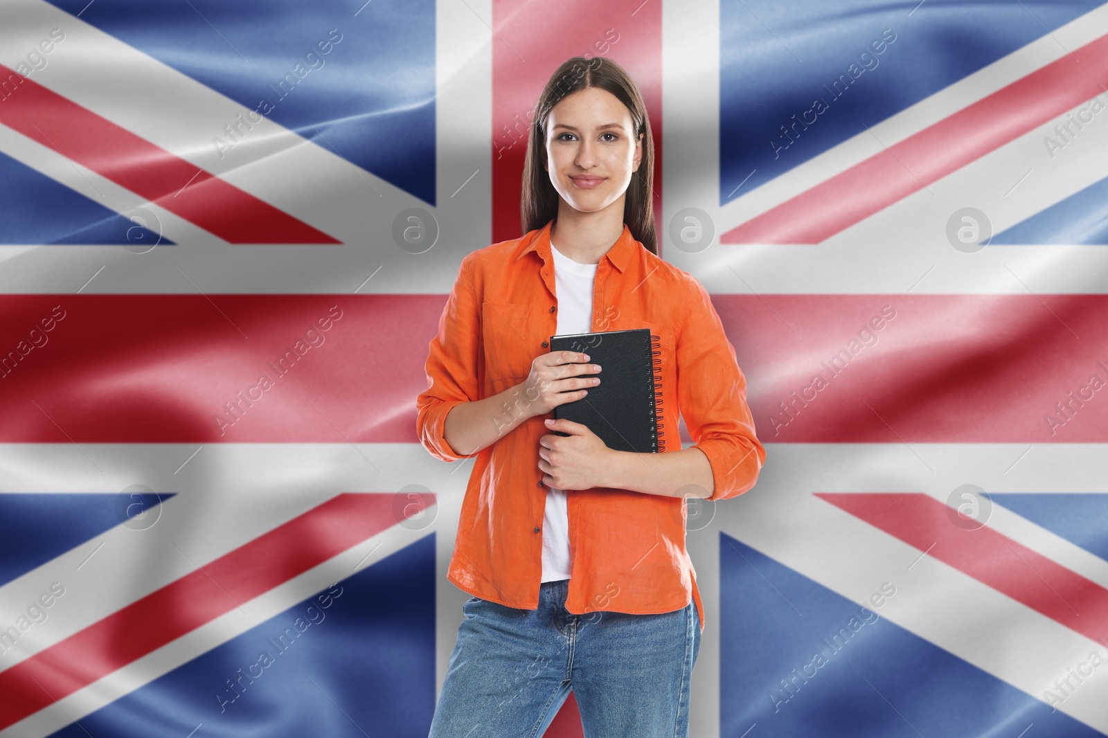 Student with notebook against flag of United Kingdom. Language school Image of Student with notebook against flag of United Kingdom. Language school