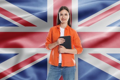 Image of Student with notebook against flag of United Kingdom. Language school