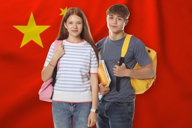 Image of Students with backpacks against flag of China. Language school