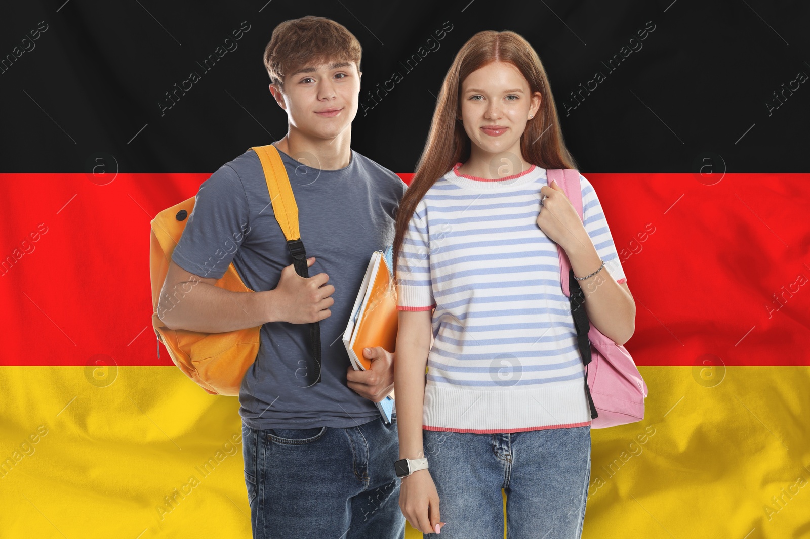 Students with backpacks against flag of Germany. Language school Image of Students with backpacks against flag of Germany. Language school
