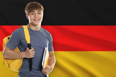 Image of Student with notebooks and backpack against flag of Germany. Language school