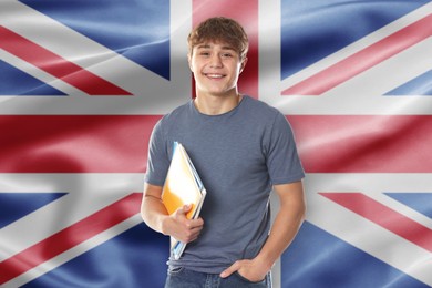 Image of Student with notebooks against flag of United Kingdom. Language school