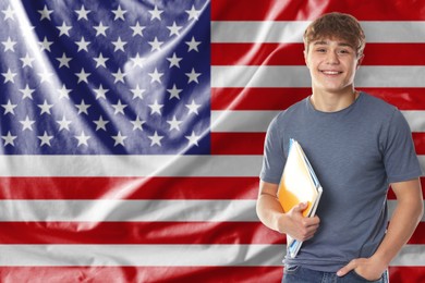 Image of Student with notebooks against flag of USA. Language school