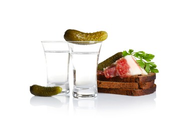 Photo of Russian vodka and different appetizers isolated on white