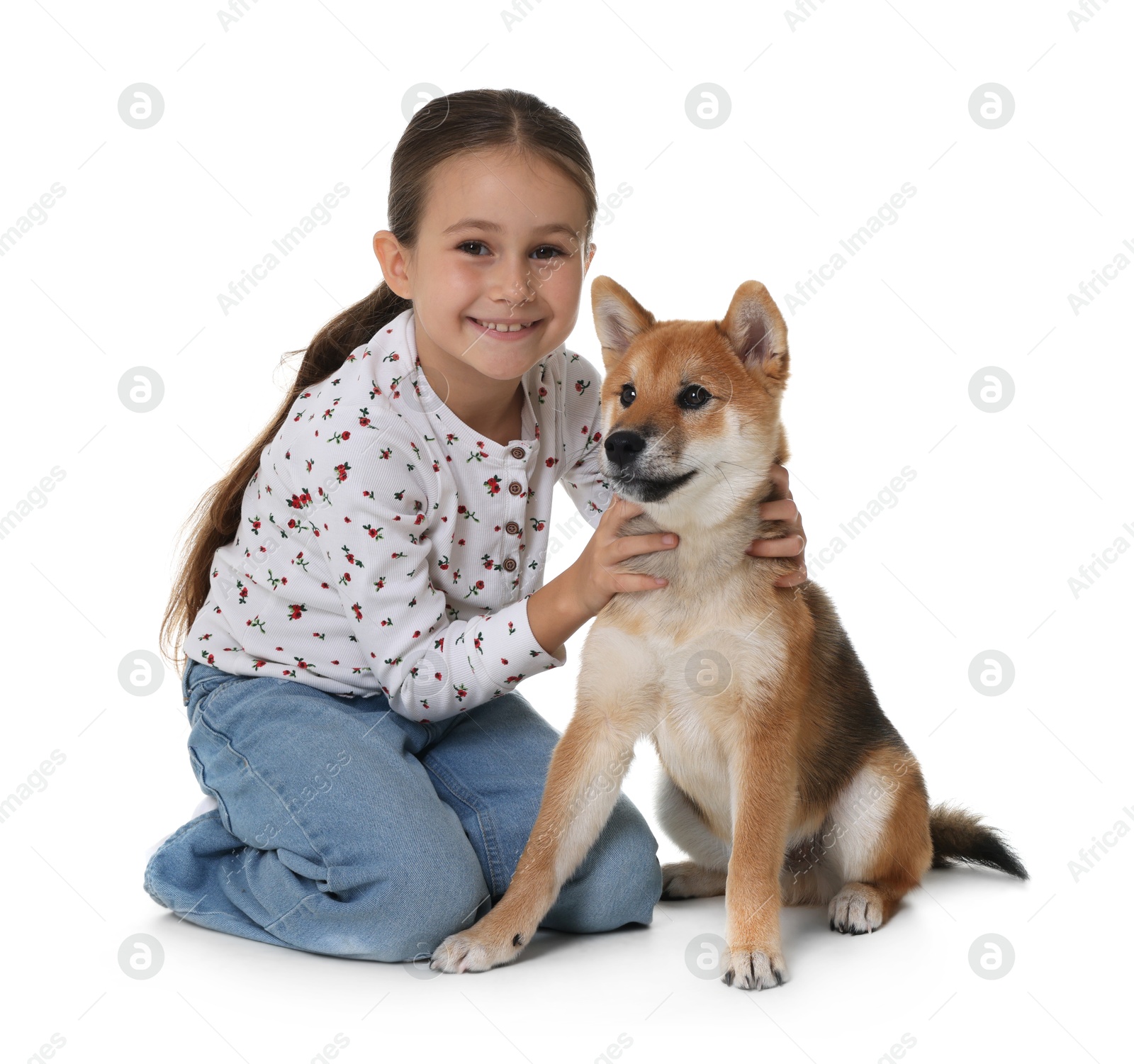 Smiling little girl with her dog on white background. Child and pet Photo of Smiling little girl with her dog on white background. Child and pet