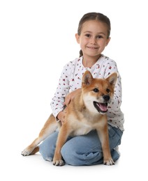 Photo of Smiling little girl with her dog on white background. Child and pet