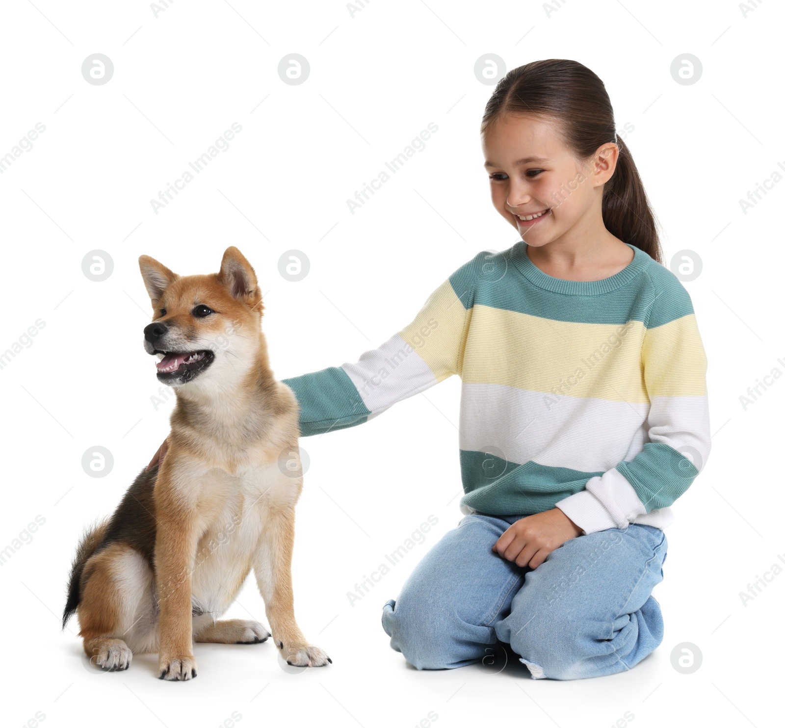 Smiling little girl with her dog on white background. Child and pet Photo of Smiling little girl with her dog on white background. Child and pet