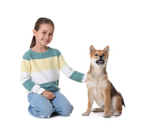 Photo of Smiling little girl with her dog on white background. Child and pet