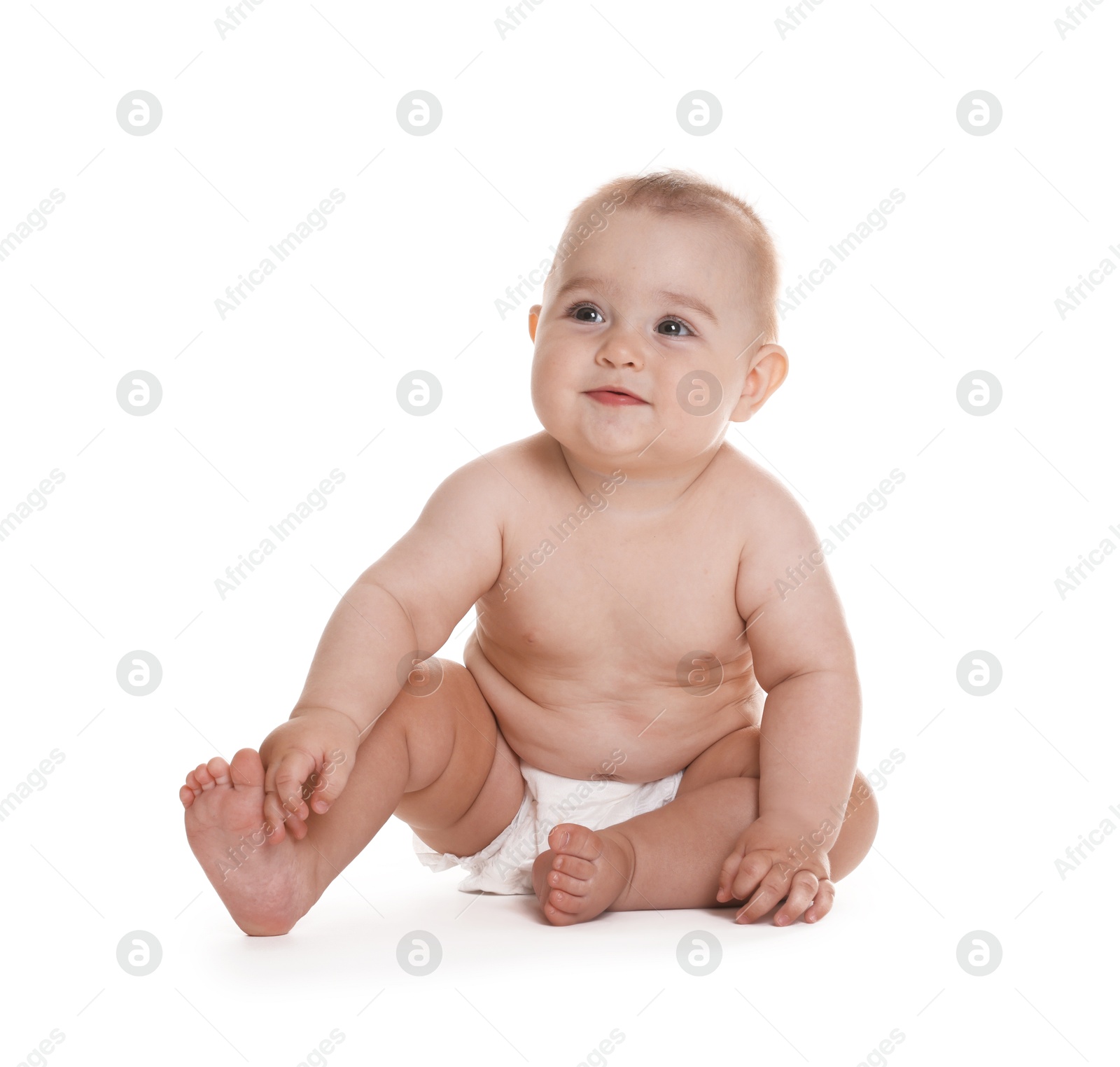 Photo of Cute little baby in diaper sitting on white background