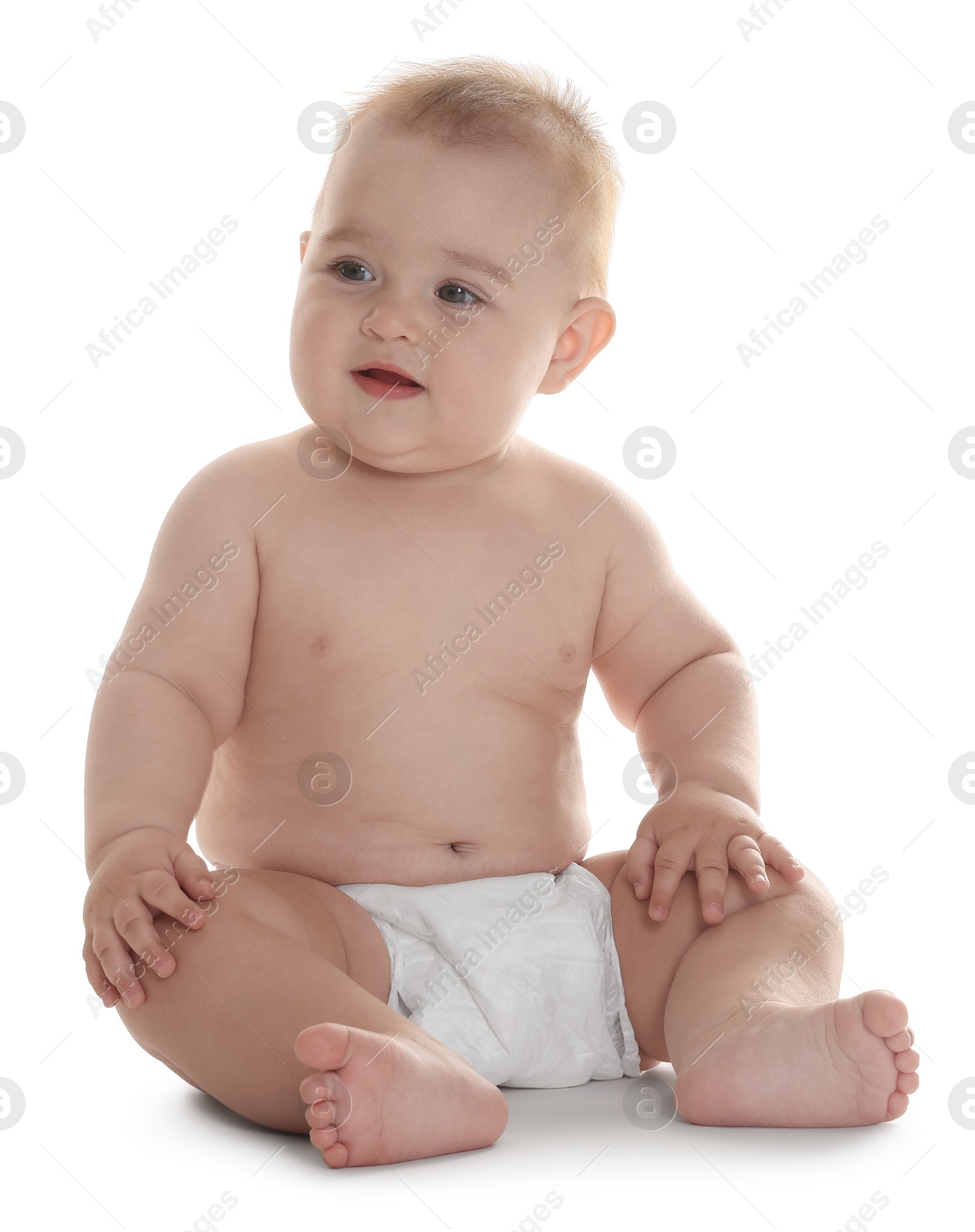 Photo of Cute little baby in diaper sitting on white background