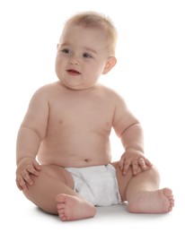 Photo of Cute little baby in diaper sitting on white background