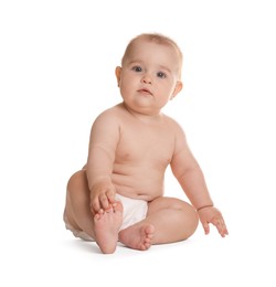 Photo of Cute little baby in diaper sitting on white background