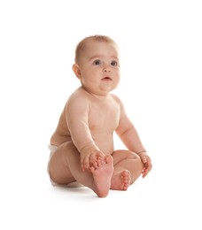 Photo of Cute little baby in diaper sitting on white background