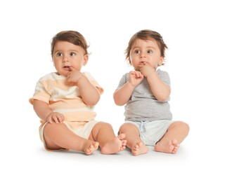 Photo of Cute little twin babies on white background